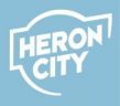 Heron city logotyp på ljusblå bakgrund